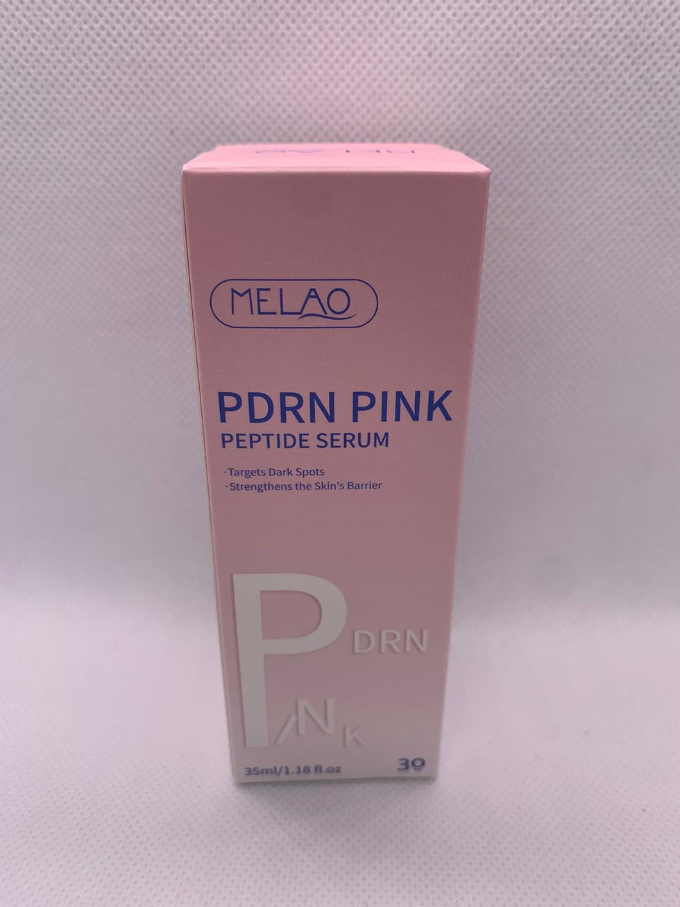 Boîte rose MELAO PDRN Pink Peptide Sérum, produit de soin.