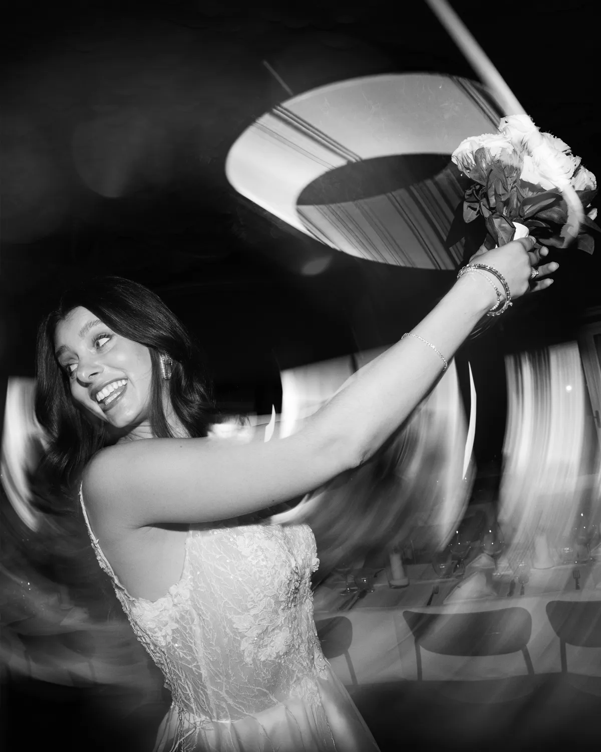 First dance under string lights with the Zurich West skyline