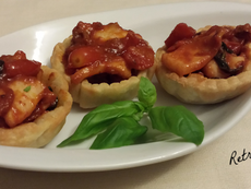 Cestini di pasta sfoglia con calamari al basilico
