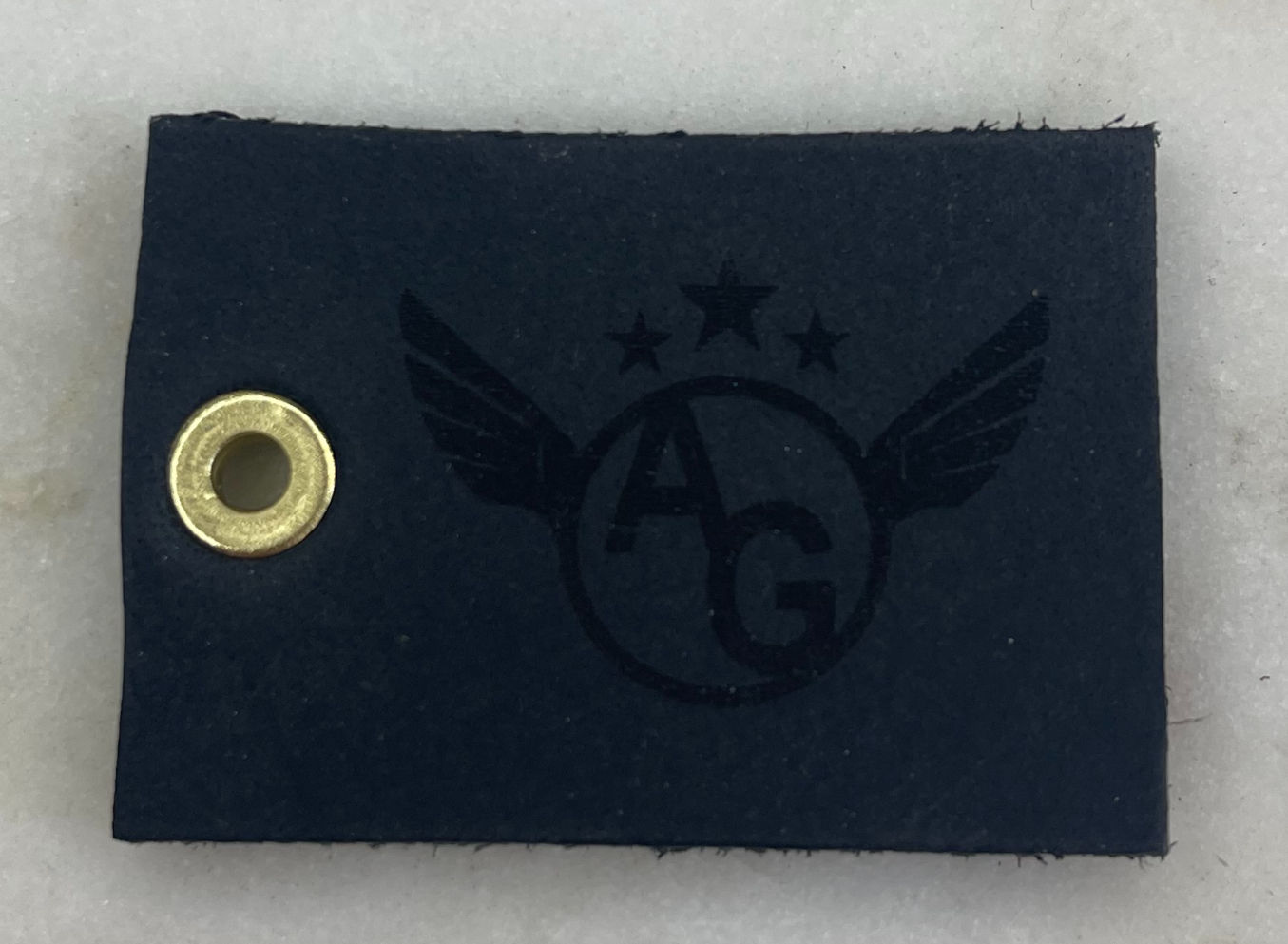 Porte-clé en cuir noir (œillet or avec logo)