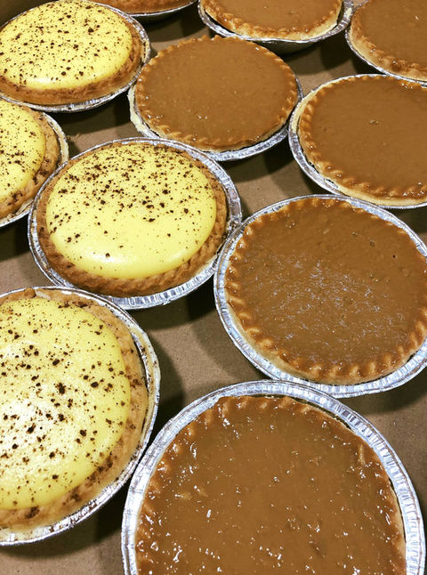 a tray of Custard Tarts and Caramel Tarts