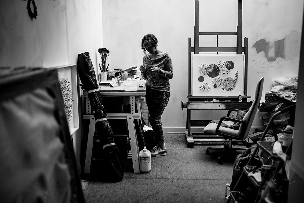 A black and white photo showing Anna Masters in her studio