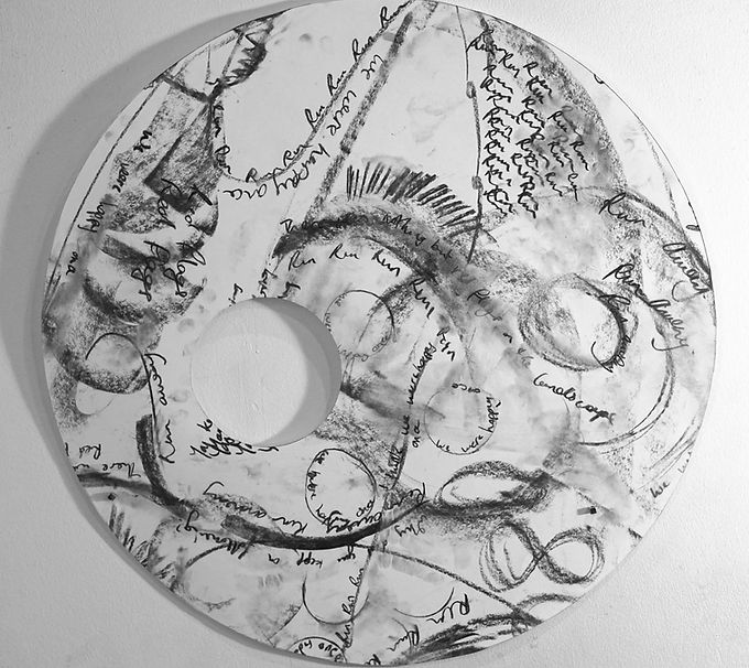 Circular charcoal line and text art with area removed