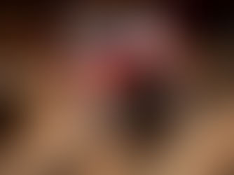 A close-up of a pirate-themed skull mug from The Beak and Barrel at Magic Kingdom, filled with an iced beverage. The mug features intricate details including a stitched eye patch, golden tooth, and a red bandana with gold accents, evoking a swashbuckling, adventurous feel.