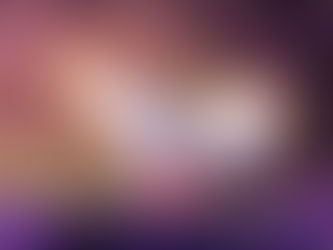 Mickey Mouse performing in the grand finale of "Fantasmic!" at Disney's Hollywood Studios. Dressed in his classic red pants and a tuxedo jacket, Mickey stands atop a rocky mountain peak as vibrant white and orange sparks erupt from his hands. The scene is illuminated by dramatic purple and pink spotlights against a dark, rocky background.