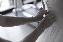 Putting on the wedding dress