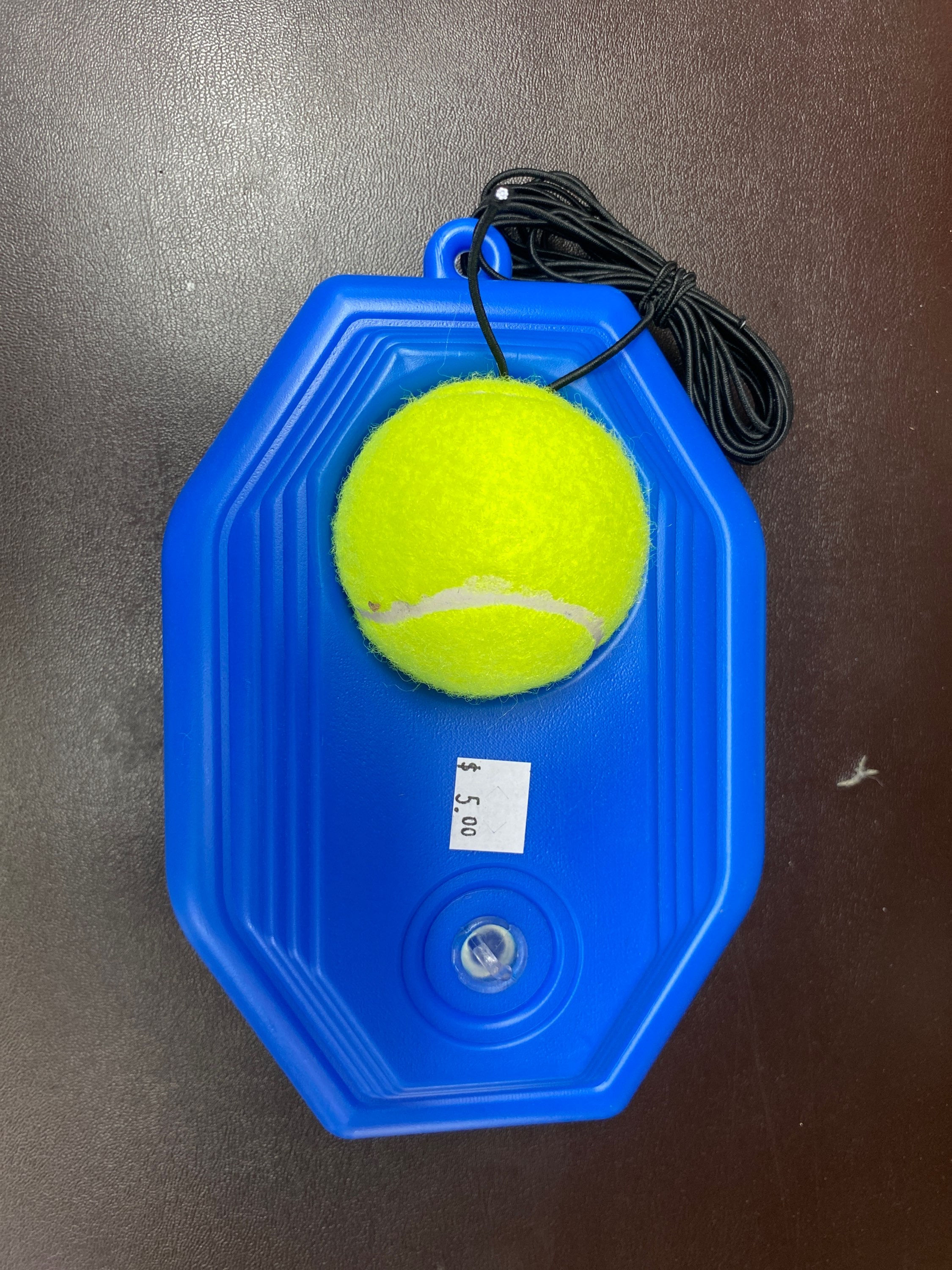 Tennis ball and holder