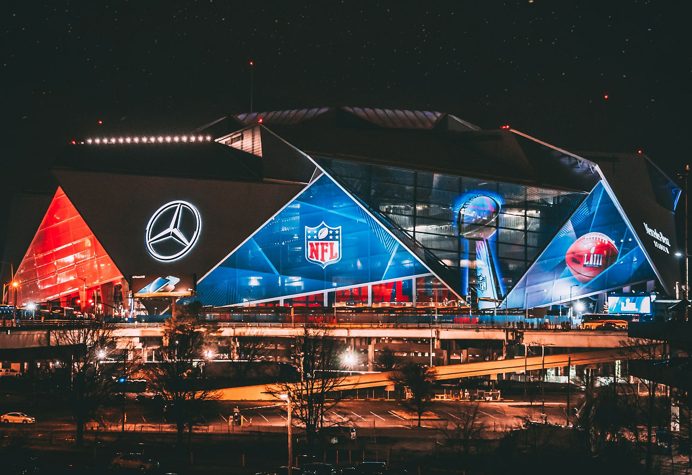 Football stadium under floodlights