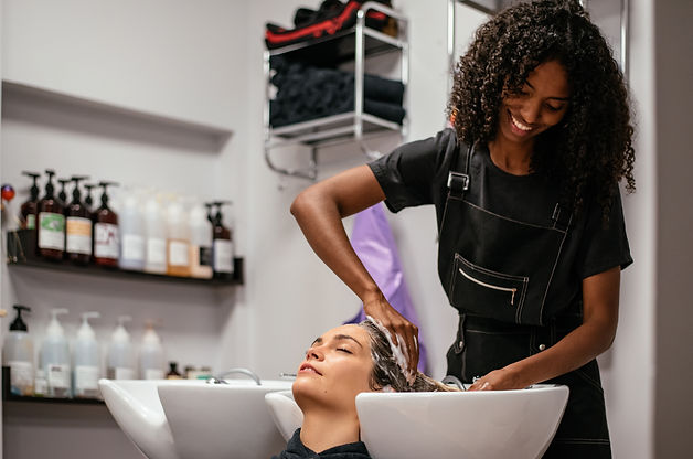 Woman having her hair washed in a salon.