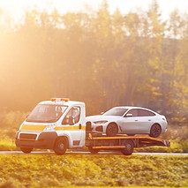 tow-truck-carries-broken-car-highway-bad-weather-roadside-assistance-helps-driver-trouble-