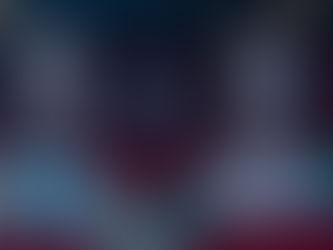 Ryan Gosling and Emma Stone sitting in a theater in La La Land