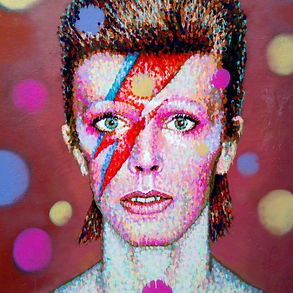 The pointillist-style street art of James Cochran created in 2013 in Brixton, depicting David Bowie as Ziggy Stardust