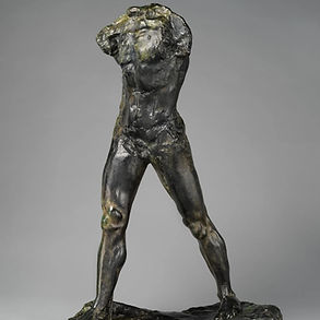 a headless and armless male figure cast in bronze striding forward with powerful, exaggerated muscles