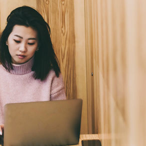 Woman at cafe on laptop 