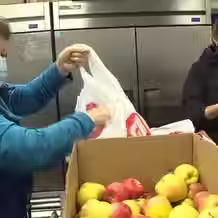 bagging apples at peachland food bank