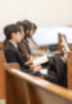 church members in pews with bibles