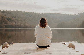 Woman at the edge of the water on a dock