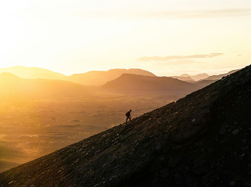 Person climbing a winding path, symbolizing the journey through multiple addictions to recovery