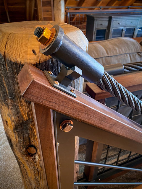 Custom steel stair rails with walnut wood and silicon bronze fasteners