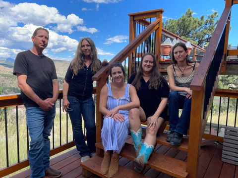 Lost Penny band on steps with clouds