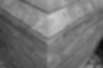 Close-up of brick wall and render