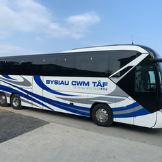 White and blue coach from side view.jpeg