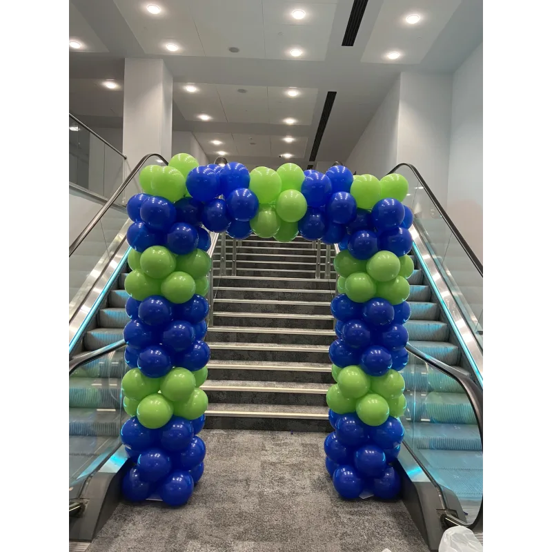 Lime green and royal blue balloons in square arch in front of steps
