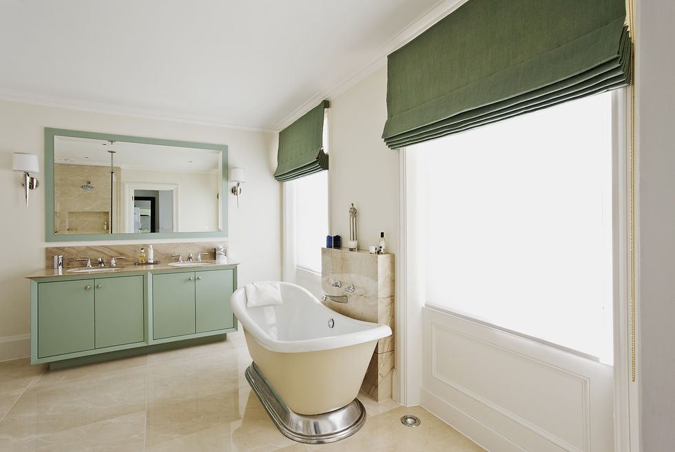 green Roman blinds in cream and green bathroom