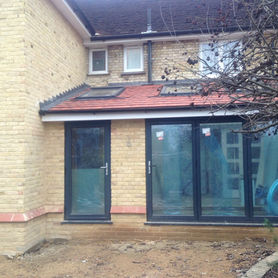 Patio doors leading out to paved garden