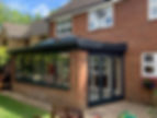 Home with black conservatory doors and windows