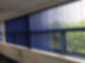 Blue vertical blinds in commercial space