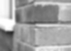 Close-up of broken mortar in brick wall