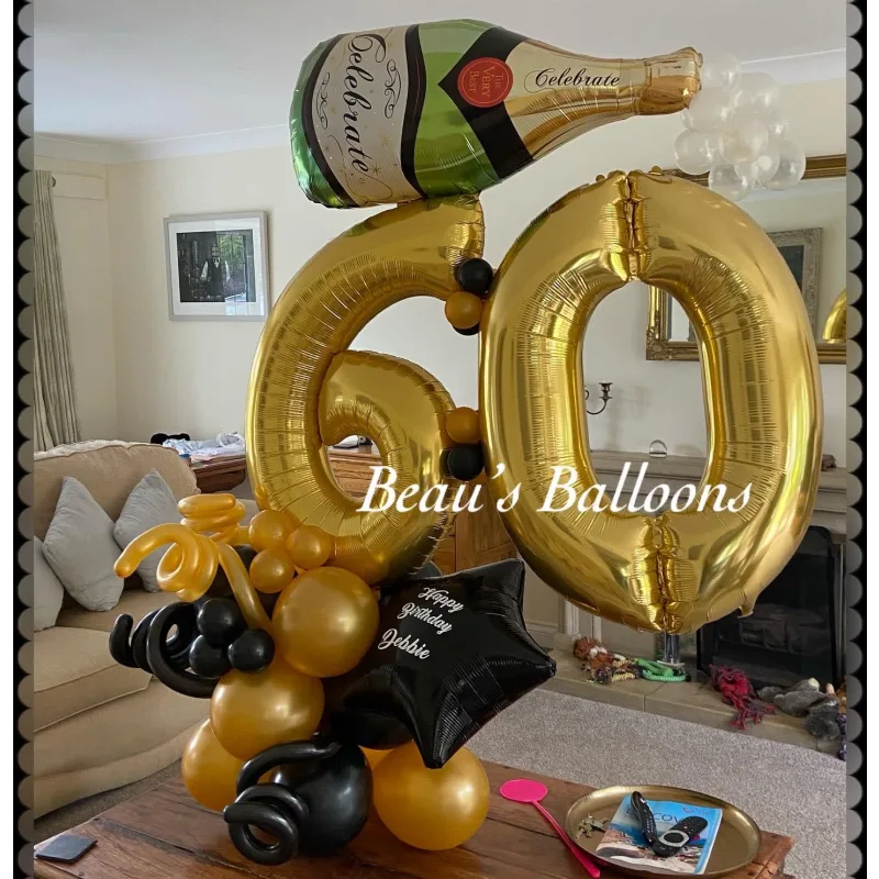 Large gold '60' balloon with champagne bottle