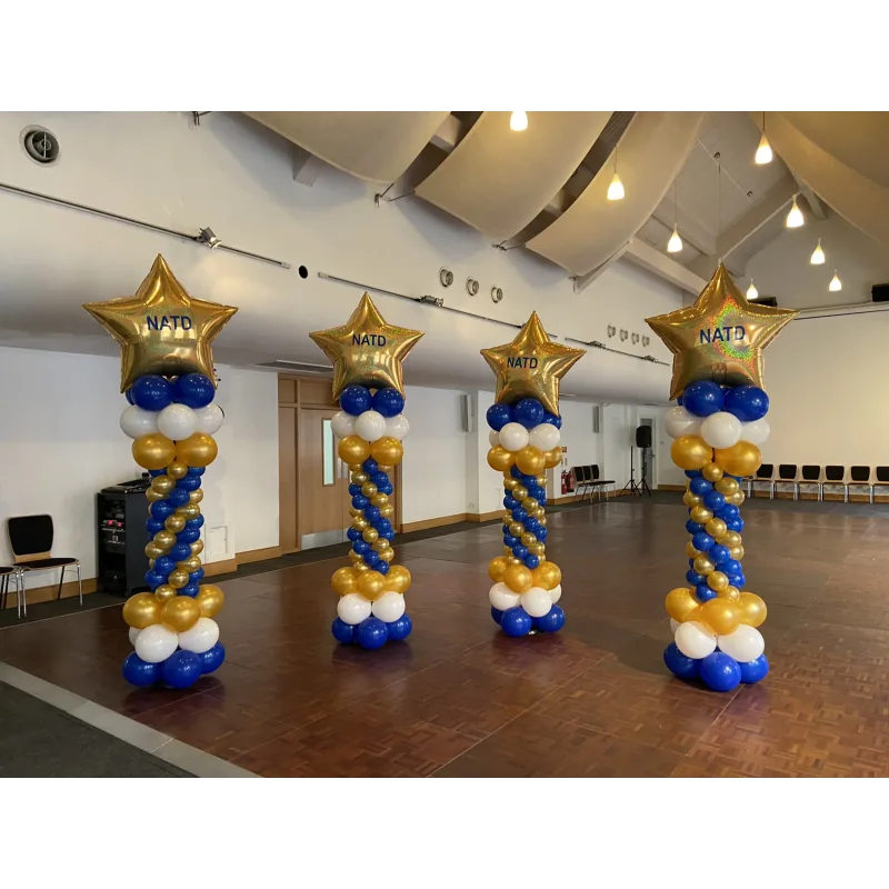Royal blue, white and gold balloon towers with gold 'NATD' star balloon at the top