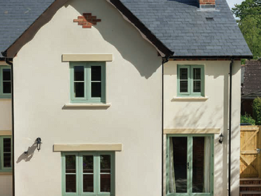 Pale green windows and doors on modern home