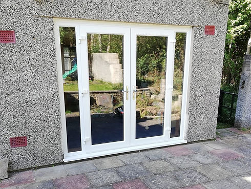 White conservatory back doors with glass windows.jpg