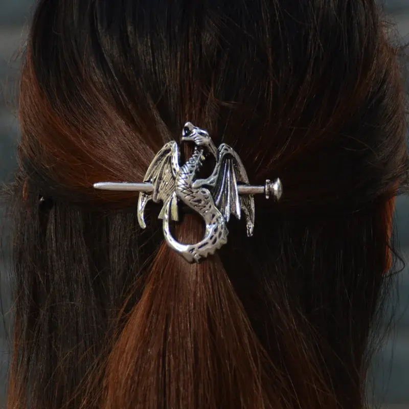 Thumbnail: Silver dragon hair slide on brown hair