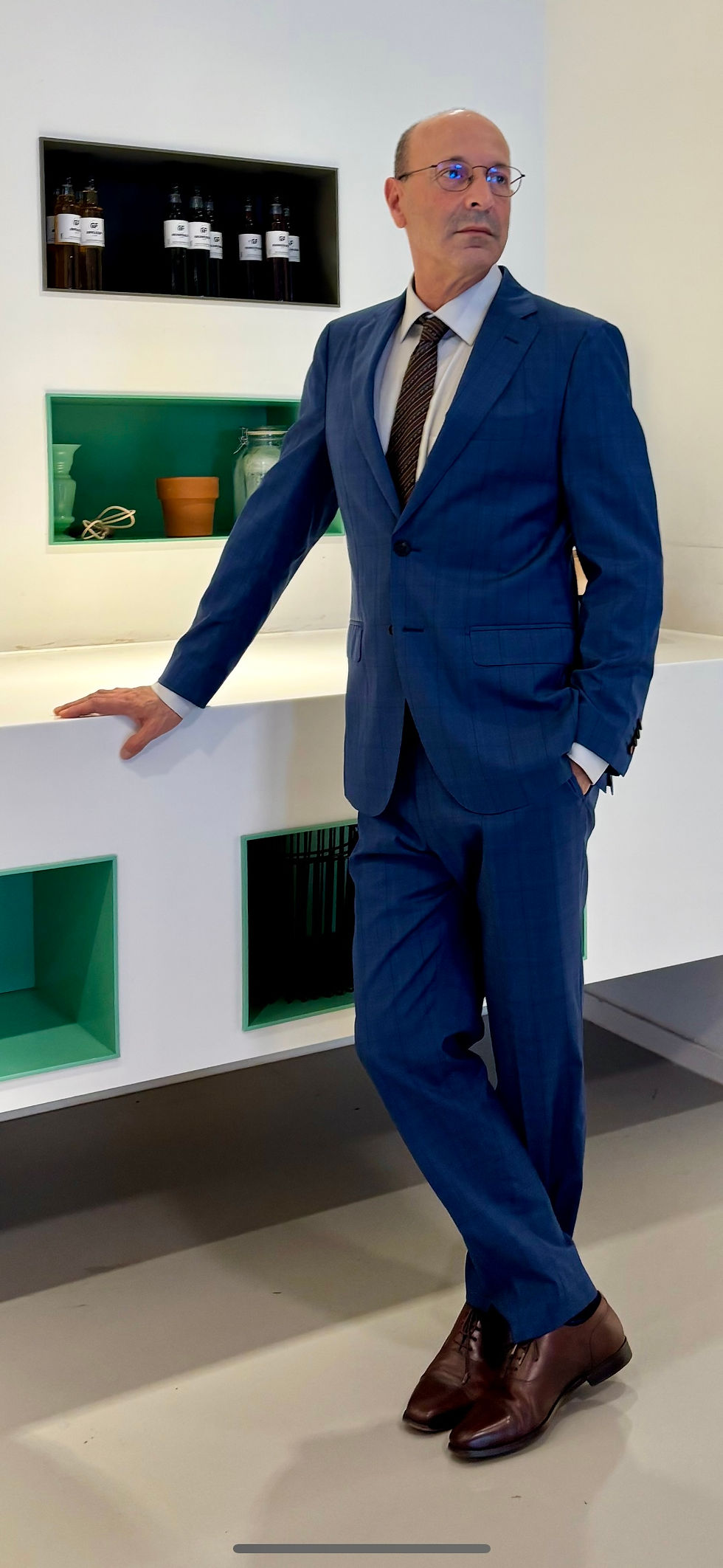 Full‑body shot in a blue suit.jpg