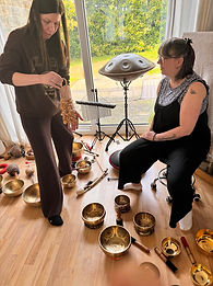 two students exploring different instruments