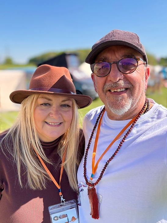neil and caroline looking at camera smiling couple