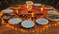 frame drums displayed on the floor in a circle at a drumming circle