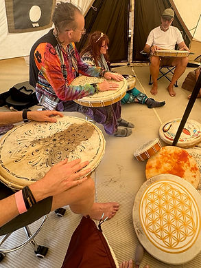 group talk about reiki drum methos at a festival
