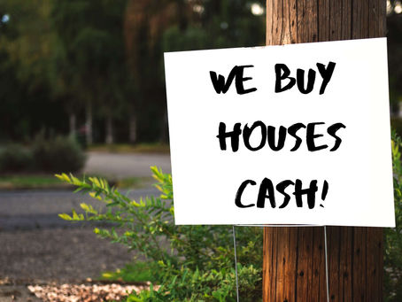 What Are Those “We Buy Houses” Signs?