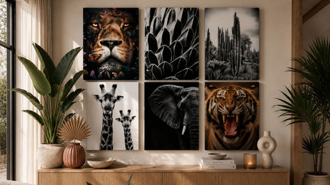 Stylish living room with six animal prints, tall plants, and wood console; books read Wild at Heart and This Is Home.