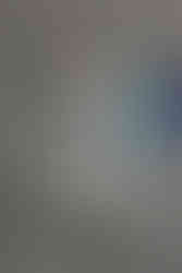 Oversized hoodie + messy bun + mismatched socks