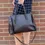 Thumbnail: Chocolate Nina satchel handbag styled on model, elegant medium-sized shoulder bag