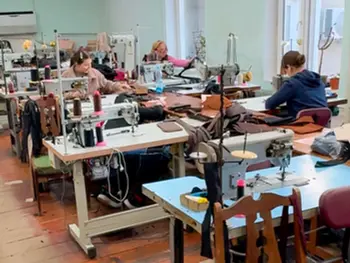 Ukrainian artisans working on handmade bags in a workshop
