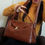 Thumbnail: Vegan Leather Shoulder Bag Ludmila Video with Model in Brown Color