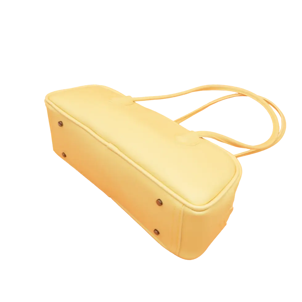 Thumbnail: Side view of yellow vegan leather shoulder bag Stella, lightweight design with minimalist structured shape