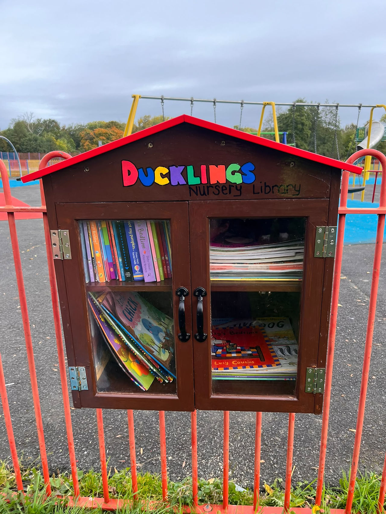 Children using the Ducklings Library at the David Lewis Play Area